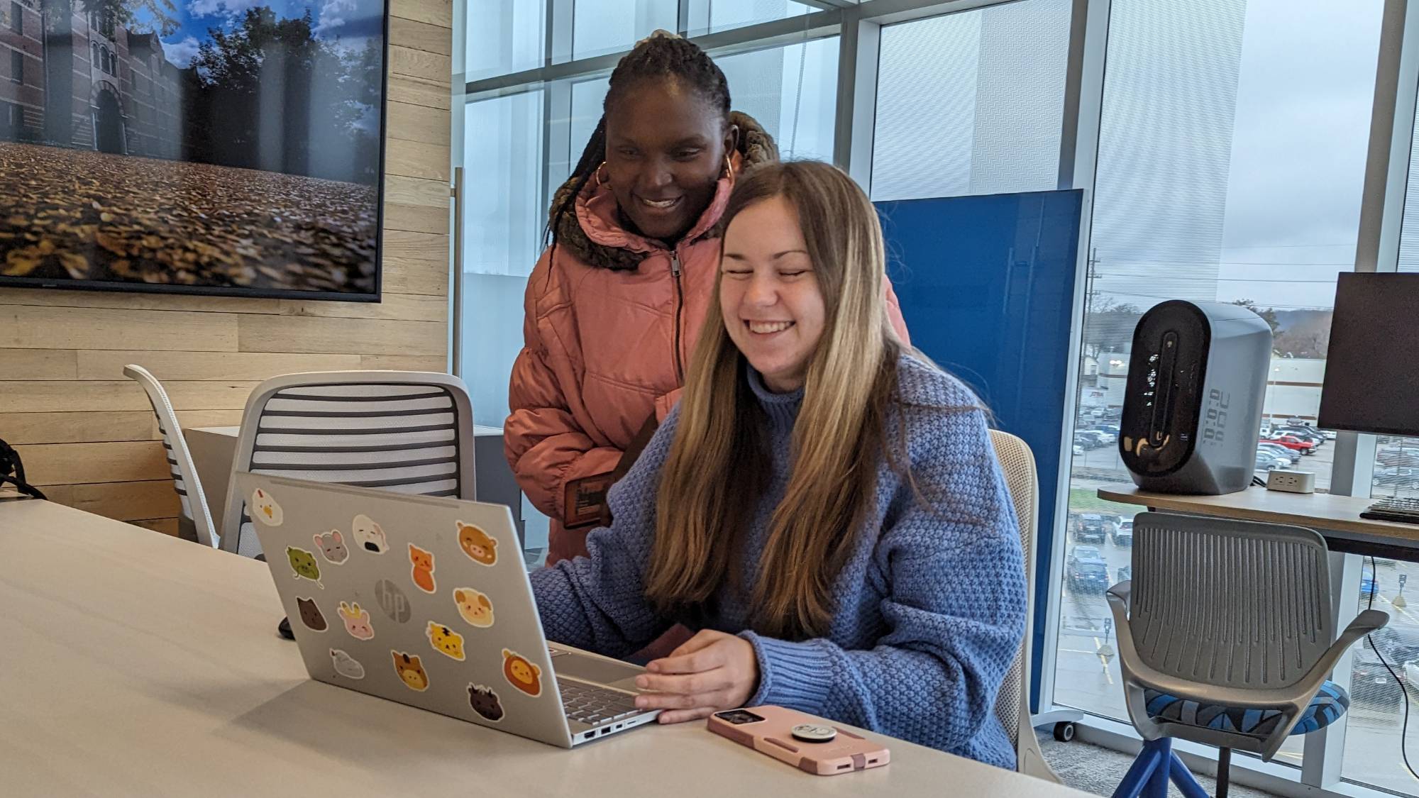 Students working on a laptop